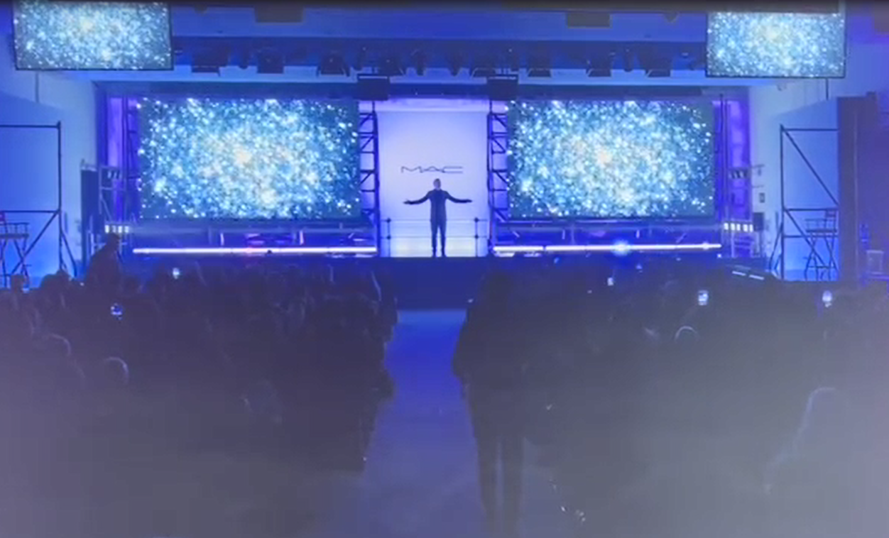 Sieko on stage at a corporate event
