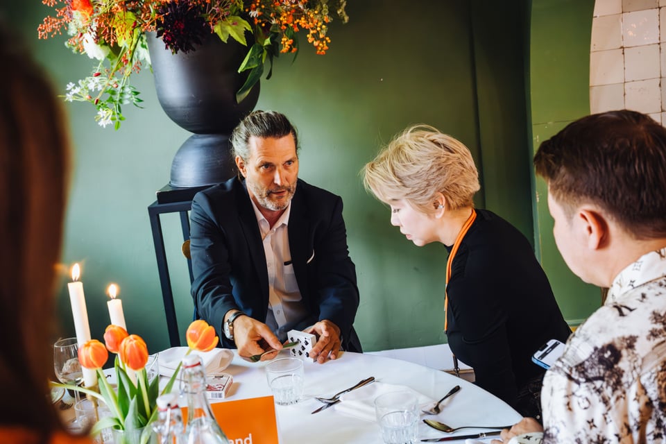 Corporate magician Nice performing during a networking reception for international guests