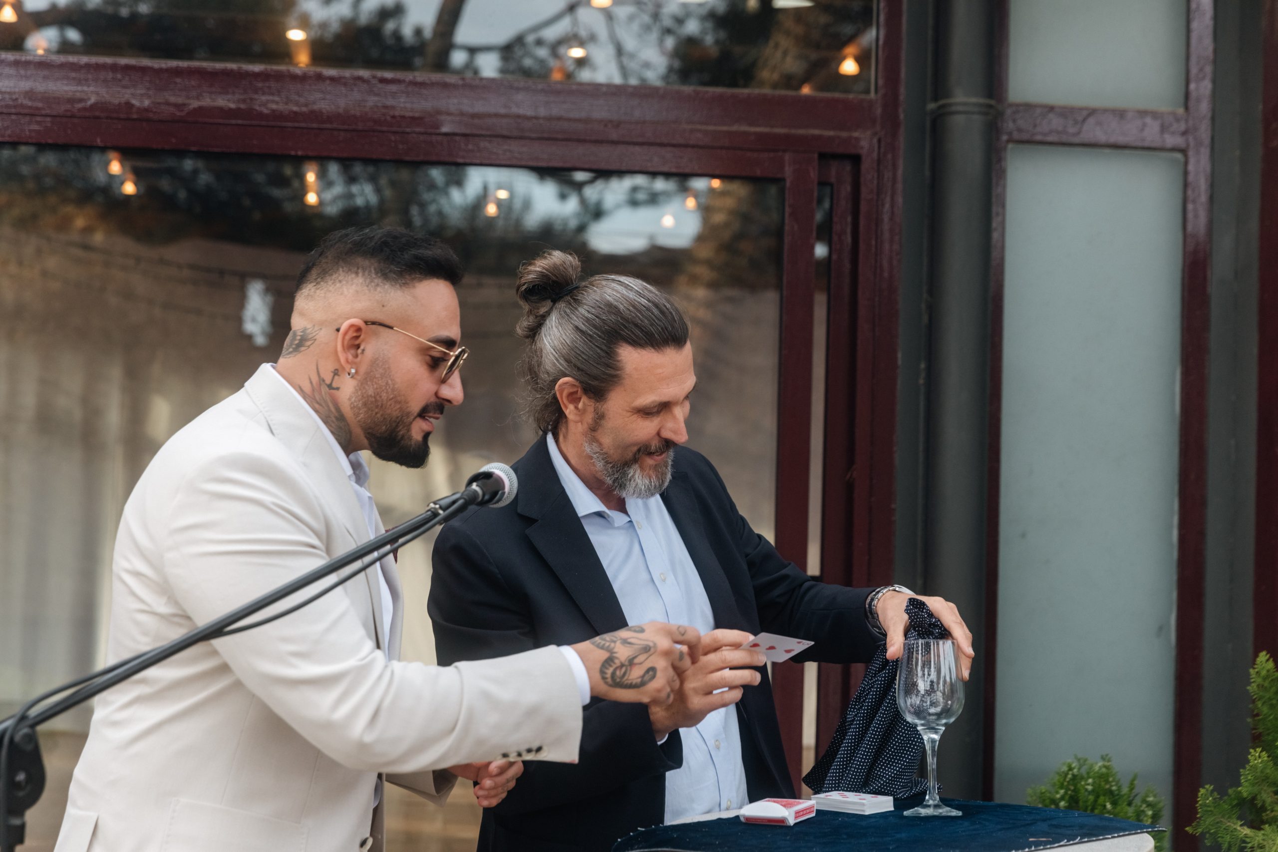 Destination wedding magician Ibiza entertaining guests during cocktail hour