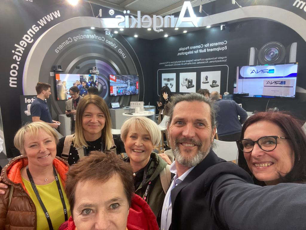 How to attract visitors to trade show booth: a crowd forming around Sieko's stand activation at ISE Barcelona